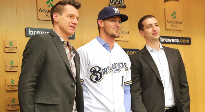 Jan 15, 2019; Milwaukee, WI, USA; Milwaukee Brewers catcher, Yasmani Grandal (center) poses for a photo at a news conference introducing the free agent signing at Miller Park. Mandatory Credit: Mike De Sisti/Milwaukee Journal Sentinel-USA TODAY NETWORK Jan 15, 2019; Milwaukee, WI, USA; Milwaukee Brewers catcher, Yasmani Grandal (center) poses for a photo at a news conference introducing the free agent signing at Miller Park. Mandatory Credit: Mike De Sisti/Milwaukee Journal Sentinel-USA TODAY NETWORK
