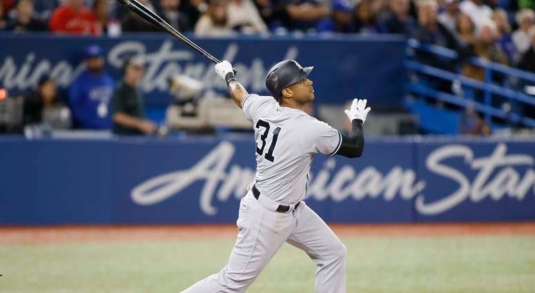 Yankees center fielder Aaron Hicks hits a three-run home run against the Blue Jays on June 5, 2018, at the Rogers Centre in Toronto. Yankees center fielder Aaron Hicks hits a three-run home run against the Blue Jays on June 5, 2018, at the Rogers Centre in Toronto.