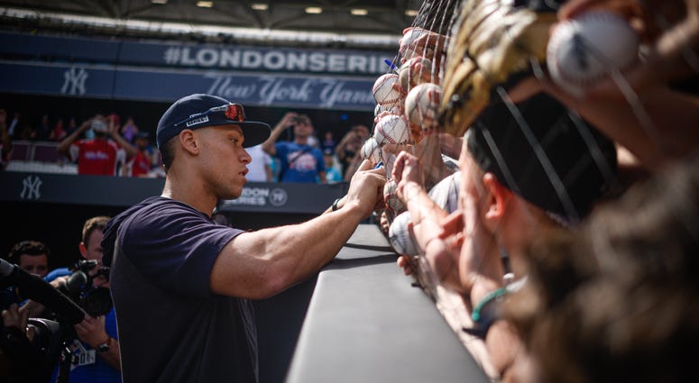 Yankees outfielder Aaron Judge signs autographs at The London Stadium on June 28, 2019, in London. Yankees outfielder Aaron Judge signs autographs at The London Stadium on June 28, 2019, in London.