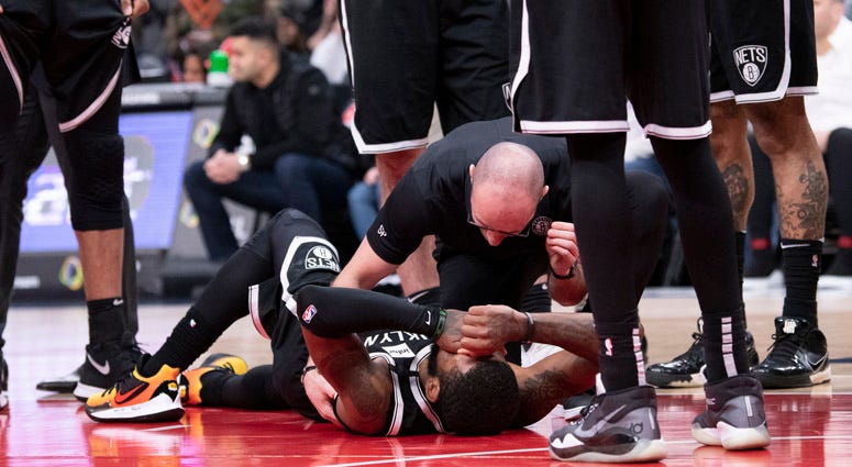 Brooklyn Nets staff tends to guard Kyrie Irving (11) during the second half against the Washington Wizards at Capital One Arena. Brooklyn Nets staff tends to guard Kyrie Irving (11) during the second half against the Washington Wizards at Capital One Arena.