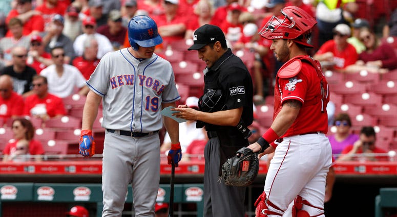 The Mets' Jay Bruce looks over the lineup card with home plate umpire Gabe Morales during the first inning on May 9, 2018, at Great American Ball Park in Cincinnati. The Mets' Jay Bruce looks over the lineup card with home plate umpire Gabe Morales during the first inning on May 9, 2018, at Great American Ball Park in Cincinnati.