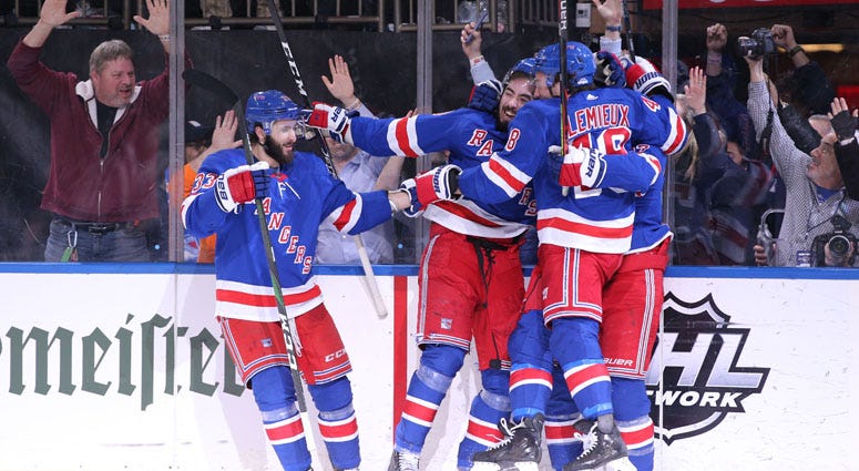 New York Rangers center Mika Zibanejad (93) celebrates his game winning goal against the Washington Capitals during overtime at Madison Square Garden. New York Rangers center Mika Zibanejad (93) celebrates his game winning goal against the Washington Capitals during overtime at Madison Square Garden.