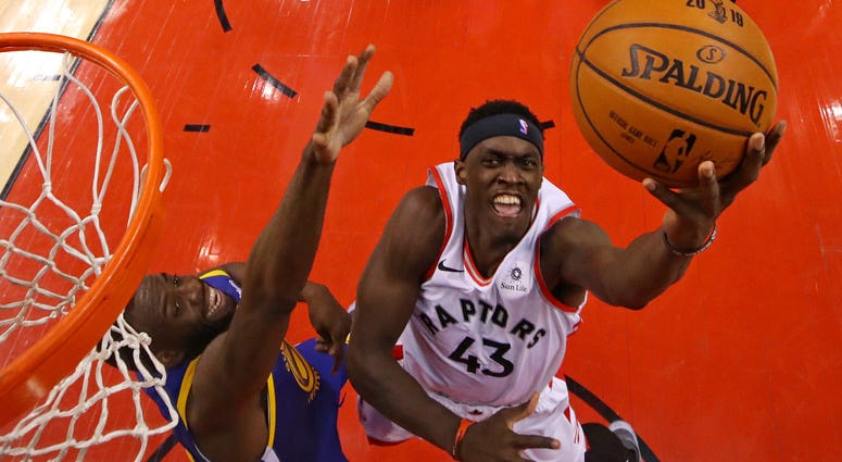 Raptors forward Pascal Siakam shoots the ball against Warriors forward Draymond Green in Game 1 of the NBA Finals on May 30, 2019, in Toronto. Raptors forward Pascal Siakam shoots the ball against Warriors forward Draymond Green in Game 1 of the NBA Finals on May 30, 2019, in Toronto.