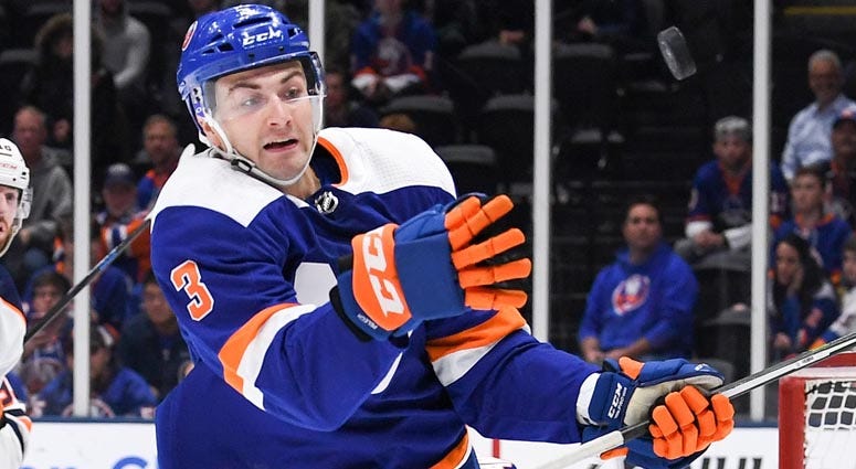 Islanders defenseman Adam Pelech attempts to catch the puck put of the air against the Edmonton Oilers during the first period at Nassau Veterans Memorial Coliseum on Oct. 8, 2019. Islanders defenseman Adam Pelech attempts to catch the puck put of the air against the Edmonton Oilers during the first period at Nassau Veterans Memorial Coliseum on Oct. 8, 2019.