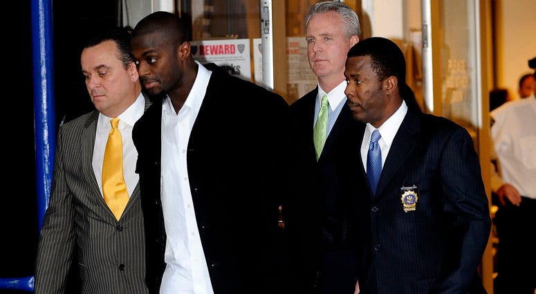 Plaxico Burress is led to a squad car for transport to his arraignment outside the NYPD 17th Precinct on Dec. 1, 2008. Plaxico Burress is led to a squad car for transport to his arraignment outside the NYPD 17th Precinct on Dec. 1, 2008.