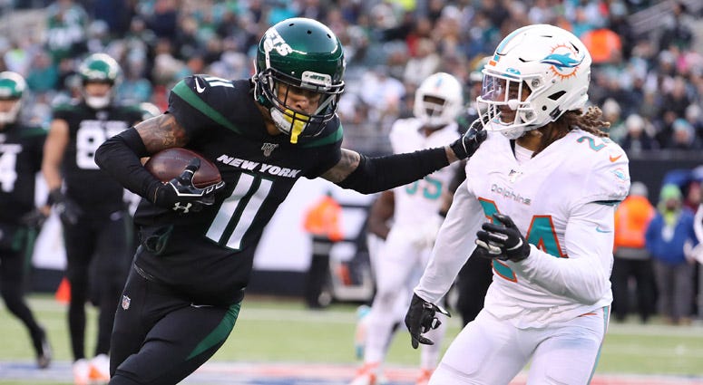  Robby Anderson of the New York Jets in action against Ryan Lewis of the Miami Dolphins during their game at MetLife Stadium on Dec. 8, 2019.