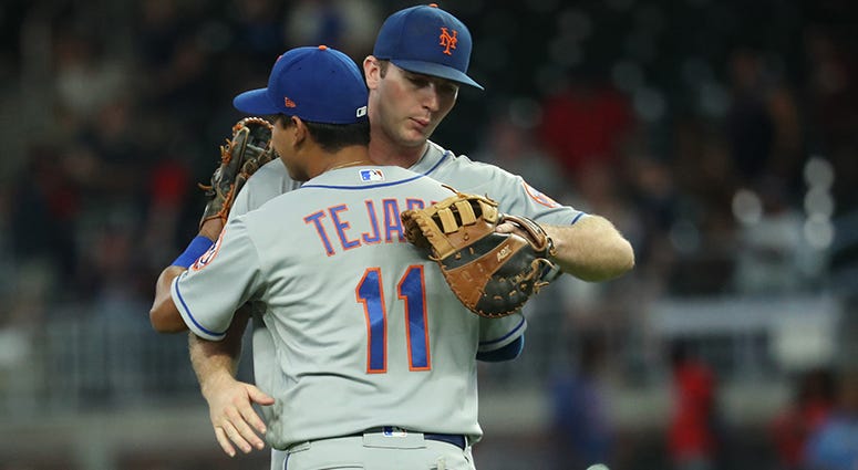 Ruben Tejada Ruben Tejada and Pete Alonso hug it out