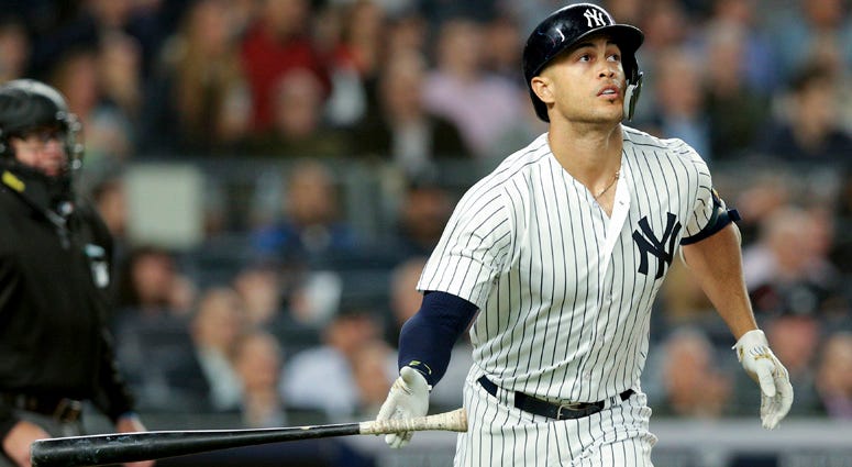 The Yankees' Giancarlo Stanton watches his solo home run against the Boston Red Sox during the fourth inning on May 8, 2018, at Yankee Stadium. The Yankees' Giancarlo Stanton watches his solo home run against the Boston Red Sox during the fourth inning on May 8, 2018, at Yankee Stadium.