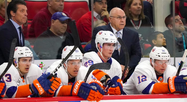 Oct 28, 2018; Raleigh, NC, USA; New York Islanders head coach Barry Trotz (right) looks on from behind the players bench against the Carolina Hurricanes at PNC Arena. Mandatory Credit: James Guillory-USA TODAY Sports Oct 28, 2018; Raleigh, NC, USA; New York Islanders head coach Barry Trotz (right) looks on from behind the players bench against the Carolina Hurricanes at PNC Arena. Mandatory Credit: James Guillory-USA TODAY Sports