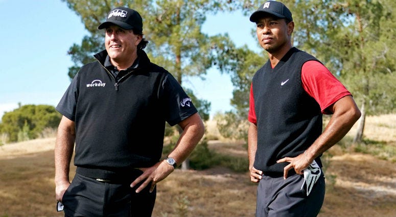Phil Mickelson and Tiger Woods on the first tee during The Match: Tiger vs Phil golf match at Shadow Creek Golf Course. Phil Mickelson and Tiger Woods on the first tee during The Match: Tiger vs Phil golf match at Shadow Creek Golf Course.