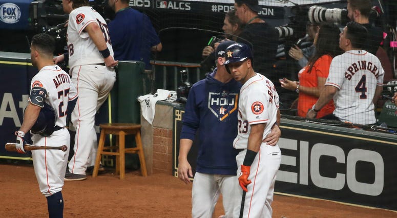 Oct 13, 2019; Houston, TX, USA; Houston Astros left fielder Michael Brantley (23) is visited by manager AJ Hinch (14) after Brantley hit a security guard with a foul ball in the fifth inning in game two of the 2019 ALCS playoff baseball series against the Oct 13, 2019; Houston, TX, USA; Houston Astros left fielder Michael Brantley (23) is visited by manager AJ Hinch (14) after Brantley hit a security guard with a foul ball in the fifth inning in game two of the 2019 ALCS playoff baseball series against the
