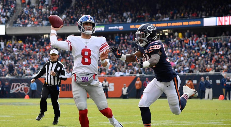 Daniel Jones (8) scrambles with the football in the first half against the Chicago Bears at Soldier Field Nov 24, 2019; Chicago, IL Daniel Jones (8) scrambles with the football in the first half against the Chicago Bears at Soldier Field Nov 24, 2019; Chicago, IL