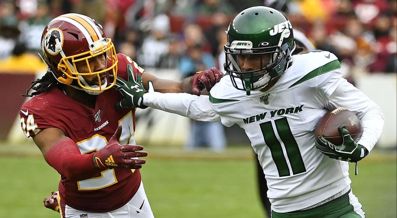 Nov 17, 2019; Landover, MD, USA; New York Jets wide receiver Robby Anderson (11) runs after a catch against Washington Redskins cornerback Josh Norman (24) during the first half at FedExField Nov 17, 2019; Landover, MD, USA; New York Jets wide receiver Robby Anderson (11) runs after a catch against Washington Redskins cornerback Josh Norman (24) during the first half at FedExField