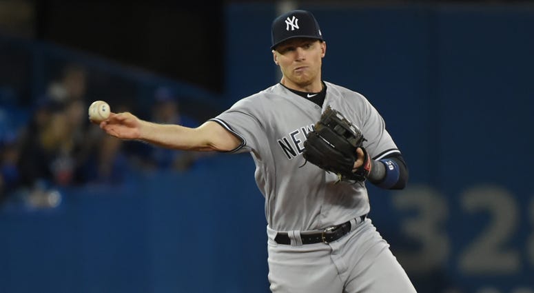 Yankees third baseman Brandon Drury throws to first base to force out the Blue Jays' Randal Grichuk on April 1, 2018, at Rogers Centre in Toronto. Yankees third baseman Brandon Drury throws to first base to force out the Blue Jays' Randal Grichuk on April 1, 2018, at Rogers Centre in Toronto.