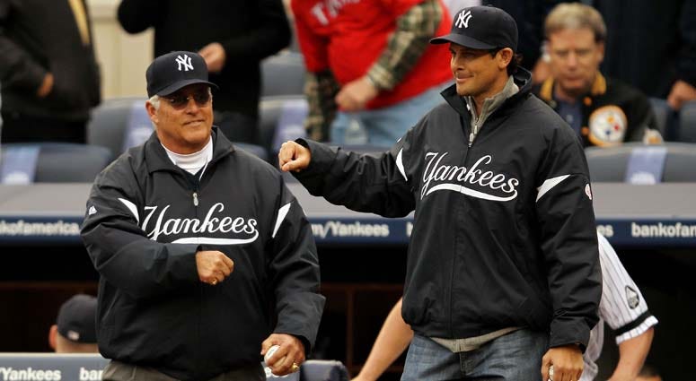 Former Yankees Bucky Dent and Aaron Boone walk onto the field to throw out the ceremonial first pitch prior to the Yankees playing against the Texas Rangers in Game 5 of the ALCS on Oct. 20, 2010, at Yankee Stadium. Former Yankees Bucky Dent and Aaron Boone walk onto the field to throw out the ceremonial first pitch prior to the Yankees playing against the Texas Rangers in Game 5 of the ALCS on Oct. 20, 2010, at Yankee Stadium.