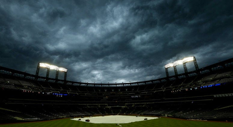 May 15, 2018; New York City, NY, USA; General view of a tarp on the field as storm clouds move in over Citi Field before a game between the New York Mets and Toronto Blue Jays. Mandatory Credit: Brad Penner-USA TODAY Sports