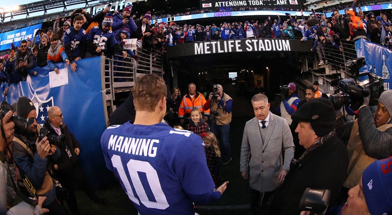Eli Manning meets his family after the Giants' 36-20 win against the Miami Dolphins on Dec. 15, 2019, at MetLife Stadium. Eli Manning meets his family after the Giants' 36-20 win against the Miami Dolphins on Dec. 15, 2019, at MetLife Stadium.