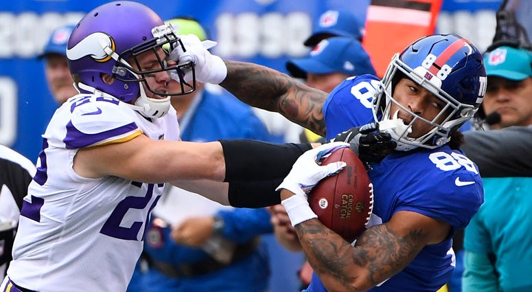Giants tight end Evan Engram gets a first down in the first quarter as Vikings free safety Harrison Smith defends on Oct. 6, 2019, at MetLife Stadium. Giants tight end Evan Engram gets a first down in the first quarter as Vikings free safety Harrison Smith defends on Oct. 6, 2019, at MetLife Stadium.