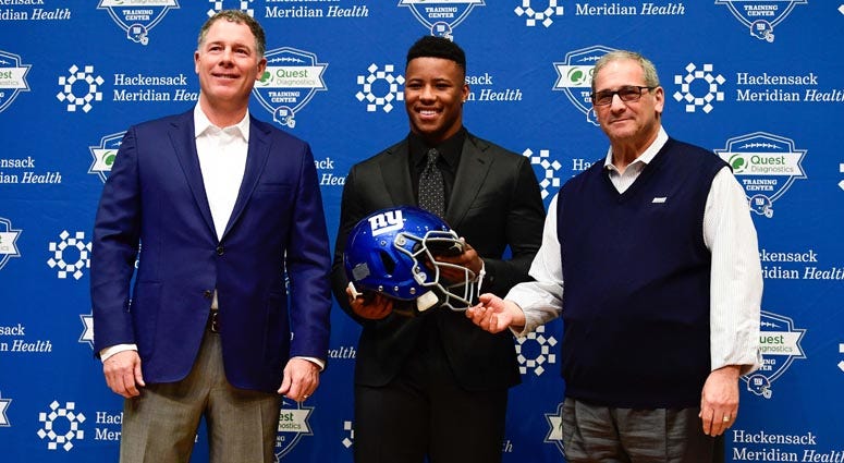 Giants coach Pat Shurmur (left), first-round draft pick Saquon Barkley (center) and general manager Dave Gettleman pose for a photo during a news conference on April 28, 2018, at Quest Diagnostics Training Center in East Rutherford, New Jersey. Giants coach Pat Shurmur (left), first-round draft pick Saquon Barkley (center) and general manager Dave Gettleman pose for a photo during a news conference on April 28, 2018, at Quest Diagnostics Training Center in East Rutherford, New Jersey.