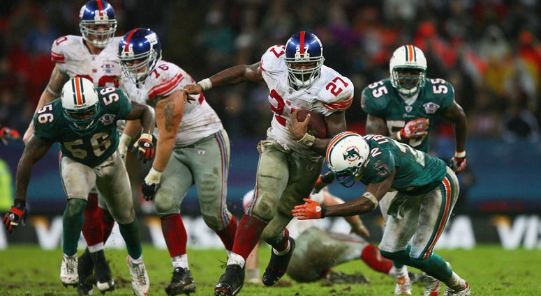 The Giants' Brandon Jacobs carries the ball against the Miami Dolphins on Oct. 28, 2007, at Wembley Stadium in London. The Giants' Brandon Jacobs carries the ball against the Miami Dolphins on Oct. 28, 2007, at Wembley Stadium in London.