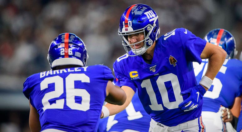 Eli Manning and Saquon Barkley Eli Manning and Saquon Barkley