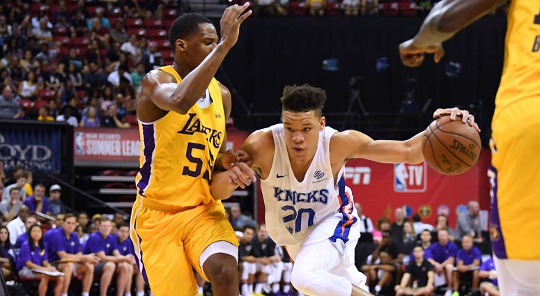 Knicks forward Kevin Knox (20) dribbles against the Lakers' Nick King during a Summer League game on July 10, 2018, at the Thomas & Mack Center in Las Vegas. Knicks forward Kevin Knox (20) dribbles against the Lakers' Nick King during a Summer League game on July 10, 2018, at the Thomas & Mack Center in Las Vegas.