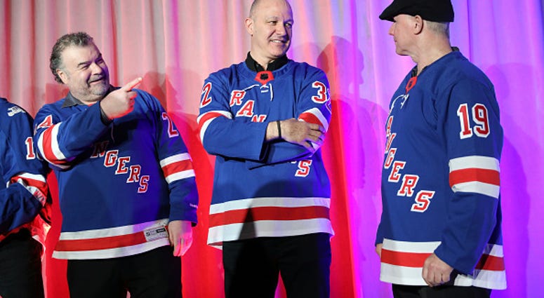 Stephane Matteau (c.) at a New York Rangers charity event.