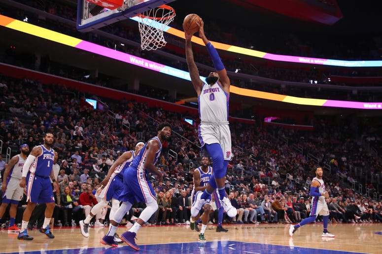 Andre Drummond of the Detroit Pistons gets to the basket next to Joel Embiid #21 of the Philadelphia 76ers during the first half at Little Caesars Arena on December 23, 2019 in Detroit, Michigan. Andre Drummond of the Detroit Pistons gets to the basket next to Joel Embiid #21 of the Philadelphia 76ers during the first half at Little Caesars Arena on December 23, 2019 in Detroit, Michigan.