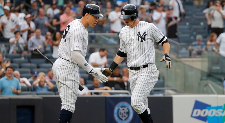 DJ LeMahieu of the New York Yankees celebrates his first-inning home run against the Toronto Blue Jays with teammate Aaron Judge at Yankee Stadium on June 25, 2019. DJ LeMahieu of the New York Yankees celebrates his first-inning home run against the Toronto Blue Jays with teammate Aaron Judge at Yankee Stadium on June 25, 2019.