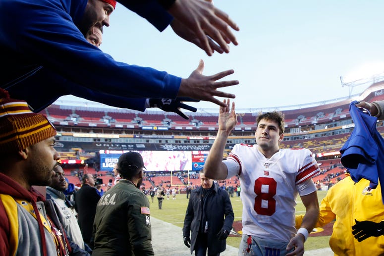 Landover, Maryland, USA; Giants quarterback Daniel Jones celebrates with fans while leaving the field after the Giants game against the Redskins at FedExField on Dec 22, 2019. Landover, Maryland, USA; Giants quarterback Daniel Jones celebrates with fans while leaving the field after the Giants game against the Redskins at FedExField on Dec 22, 2019.
