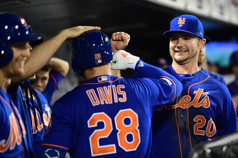 Pete Alonso congratulates J.D. Davis of the Mets after his home run in the fourth inning of their game against the Atlanta Braves at Citi Field on September 27, 2019. Pete Alonso congratulates J.D. Davis of the Mets after his home run in the fourth inning of their game against the Atlanta Braves at Citi Field on September 27, 2019.