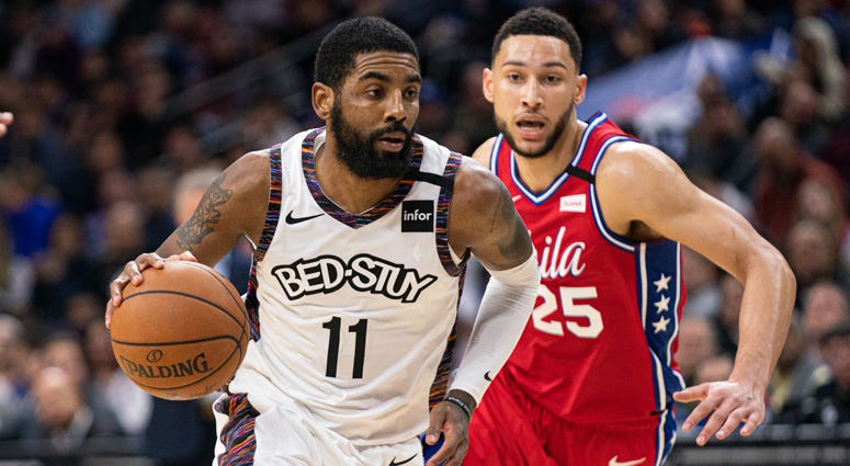 Nets guard Kyrie Irving dribbles in front of 76ers guard Ben Simmons on Jan. 15, 2020, at the Wells Fargo Center in Philadelphia. Nets guard Kyrie Irving dribbles in front of 76ers guard Ben Simmons on Jan. 15, 2020, at the Wells Fargo Center in Philadelphia.