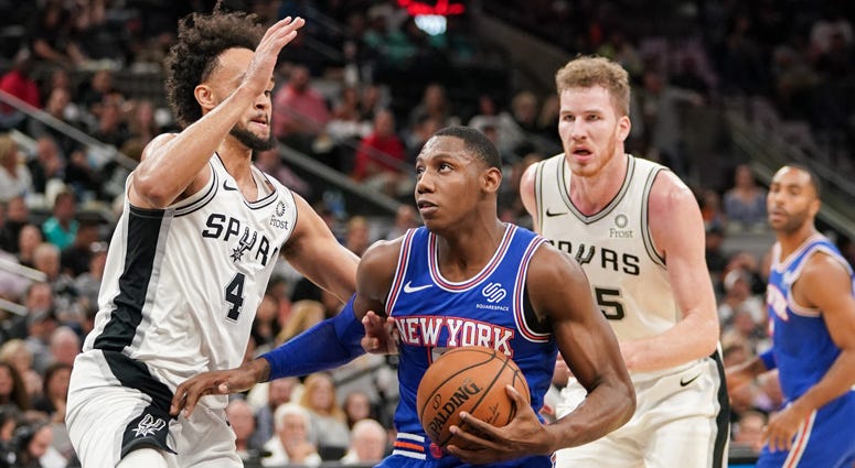 Knicks forward RJ Barrett drives in against Spurs guard Derrick White on Oct. 23, 2019, in San Antonio. Knicks forward RJ Barrett drives in against Spurs guard Derrick White on Oct. 23, 2019, in San Antonio.
