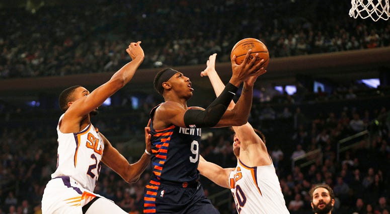 Knicks guard RJ Barrett goes up for a shot between the Phoenix Suns' Mikal Bridges and Dario Saric (20) on Jan. 16, 2020, at Madison Square Garden. Knicks guard RJ Barrett goes up for a shot between the Phoenix Suns' Mikal Bridges and Dario Saric (20) on Jan. 16, 2020, at Madison Square Garden.