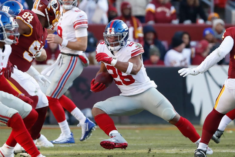 Giants running back Saquon Barkley carries the ball past Washington Redskins nose tackle Daron Payne in the second quarter at FedExField on Dec 22, 2019. Giants running back Saquon Barkley carries the ball past Washington Redskins nose tackle Daron Payne in the second quarter at FedExField on Dec 22, 2019.