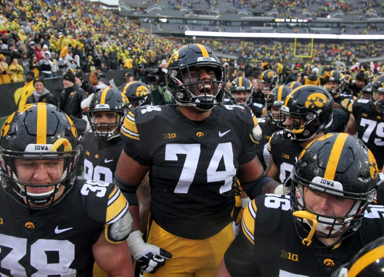 Offensive lineman Tristan Wirfs of the Iowa Hawkeyes celebrates with teammates after their match-up against the Nebraska Cornhuskers on November 23, 2018 at Kinnick Stadium, in Iowa City, Iowa. Offensive lineman Tristan Wirfs of the Iowa Hawkeyes celebrates with teammates after their match-up against the Nebraska Cornhuskers on November 23, 2018 at Kinnick Stadium, in Iowa City, Iowa.