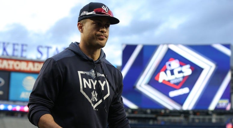 New York Yankees left fielder Giancarlo Stanton (27) walks off the field after fielding balls in the outfield during batting practice before game four of the 2019 ALCS playoff baseball series on Oct 17, 2019 against the Houston Astros. New York Yankees left fielder Giancarlo Stanton (27) walks off the field after fielding balls in the outfield during batting practice before game four of the 2019 ALCS playoff baseball series on Oct 17, 2019 against the Houston Astros.