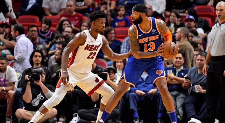 Knicks forward Marcus Morris defended by Miami Heat forward Jimmy Butler Dec 20, 2019; Miami, Florida Knicks forward Marcus Morris defended by Miami Heat forward Jimmy Butler Dec 20, 2019; Miami, Florida