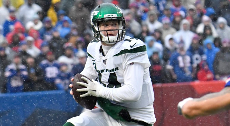 Jets quarterback Sam Darnold leaps to avoid a tackle against Buffalo Bills Dec 29, 2019; Orchard Park, New York Jets quarterback Sam Darnold leaps to avoid a tackle against Buffalo Bills Dec 29, 2019; Orchard Park, New York