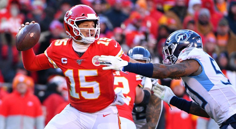 Chiefs quarterback Patrick Mahomes throws a pass against Tennessee Titans linebacker Derick Roberson Jan 19, 2020; Kansas City, Missouri Chiefs quarterback Patrick Mahomes throws a pass against Tennessee Titans linebacker Derick Roberson Jan 19, 2020; Kansas City, Missouri