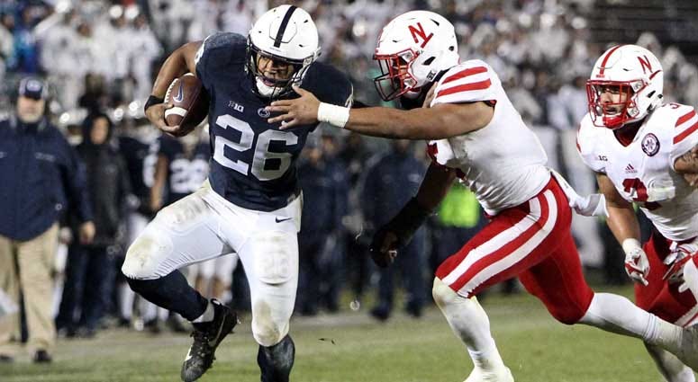 Penn State running back Saquon Barkley (26) runs the ball against Nebraska on Nov. 18, 2018, at Beaver Stadium in University Park, Pennsylvania. Penn State running back Saquon Barkley (26) runs the ball against Nebraska on Nov. 18, 2018, at Beaver Stadium in University Park, Pennsylvania.