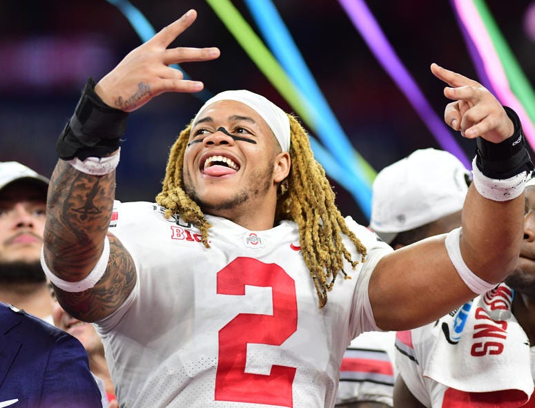 Ohio State defensive end Chase Young celebrates after the Buckeyes defeated the Wisconsin Badgers 34-21 in the 2019 Big Ten Championship Game at Lucas Oil Stadium on December 7, 2019. Ohio State defensive end Chase Young celebrates after the Buckeyes defeated the Wisconsin Badgers 34-21 in the 2019 Big Ten Championship Game at Lucas Oil Stadium on December 7, 2019.