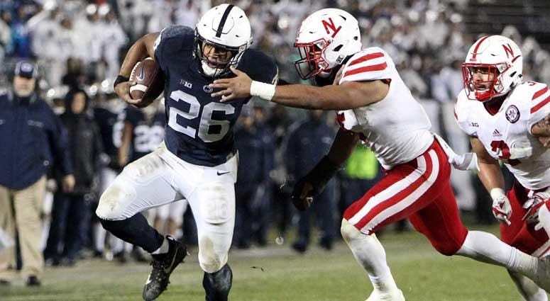 Penn State running back Saquon Barkley (26) runs the ball against Nebraska on Nov. 18, 2018, at Beaver Stadium in University Park, Pennsylvania. Penn State running back Saquon Barkley (26) runs the ball against Nebraska on Nov. 18, 2018, at Beaver Stadium in University Park, Pennsylvania.
