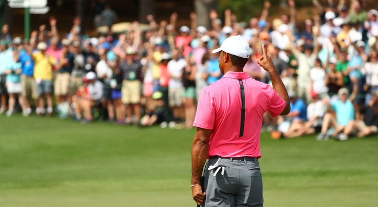 Tiger Woods reacts after making a putt from off the green for eagle on the second hole during a practice round for the Masters on April 2, 2018, at Augusta National. Tiger Woods reacts after making a putt from off the green for eagle on the second hole during a practice round for the Masters on April 2, 2018, at Augusta National.