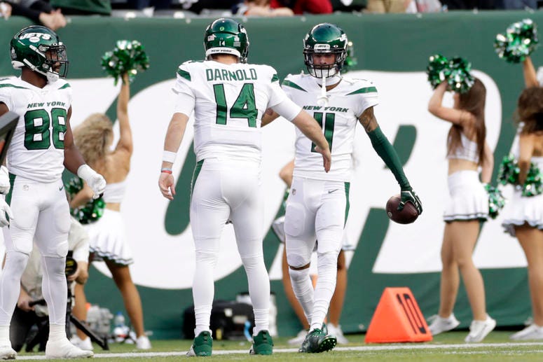 New York Jets quarterback Sam Darnold (14) celebrates a touchdown with Robby Anderson (11) during the first half of an NFL football game against the Dallas Cowboys, Sunday, Oct. 13, 2019, in East Rutherford, N.J. New York Jets quarterback Sam Darnold (14) celebrates a touchdown with Robby Anderson (11) during the first half of an NFL football game against the Dallas Cowboys, Sunday, Oct. 13, 2019, in East Rutherford, N.J.