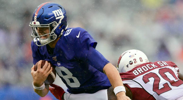 OCTOBER 20: Daniel Jones #8 of the New York Giants runs the ball against Tramaine Brock #20 of the Arizona Cardinals during the second half at MetLife Stadium on October 20, 2019 in East Rutherford, New Jersey. OCTOBER 20: Daniel Jones #8 of the New York Giants runs the ball against Tramaine Brock #20 of the Arizona Cardinals during the second half at MetLife Stadium on October 20, 2019 in East Rutherford, New Jersey.