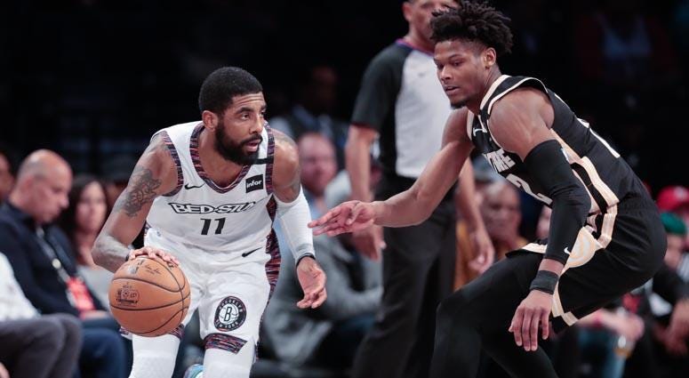 Nets guard Kyrie Irving dribbles as Atlanta Hawks forward Cam Reddish (22) defends on Jan. 12, 2020, at Barclays Center. Nets guard Kyrie Irving dribbles as Atlanta Hawks forward Cam Reddish (22) defends on Jan. 12, 2020, at Barclays Center.