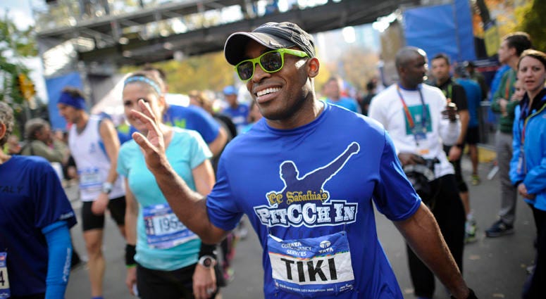 FILE -- Former Giants running back Tiki Barber makes his way through the crowd after crossing the finish line at the New York City Marathon on Nov. 1, 2015. FILE -- Former Giants running back Tiki Barber makes his way through the crowd after crossing the finish line at the New York City Marathon on Nov. 1, 2015.