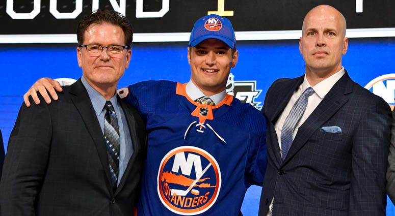 Islanders' first-round draft pick Oliver Wahlstrom poses with with team representatives after being selected as the 11th overall pick. Islanders' first-round draft pick Oliver Wahlstrom poses with with team representatives after being selected as the 11th overall pick.