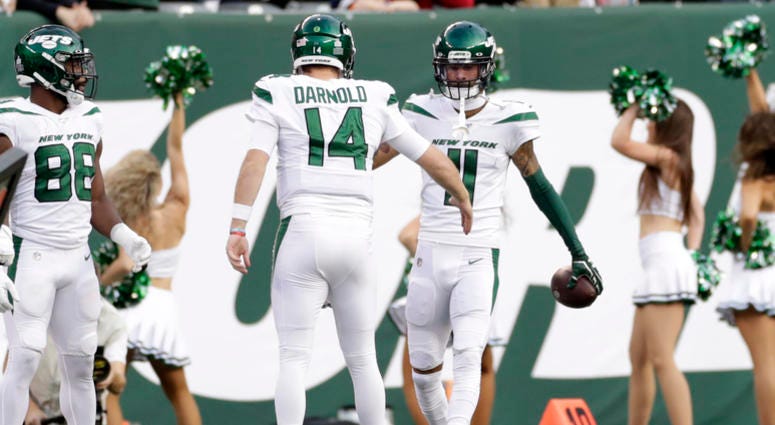 New York Jets quarterback Sam Darnold (14) celebrates a touchdown with Robby Anderson (11) during the first half of an NFL football game against the Dallas Cowboys, Sunday, Oct. 13, 2019, in East Rutherford, N.J. New York Jets quarterback Sam Darnold (14) celebrates a touchdown with Robby Anderson (11) during the first half of an NFL football game against the Dallas Cowboys, Sunday, Oct. 13, 2019, in East Rutherford, N.J.